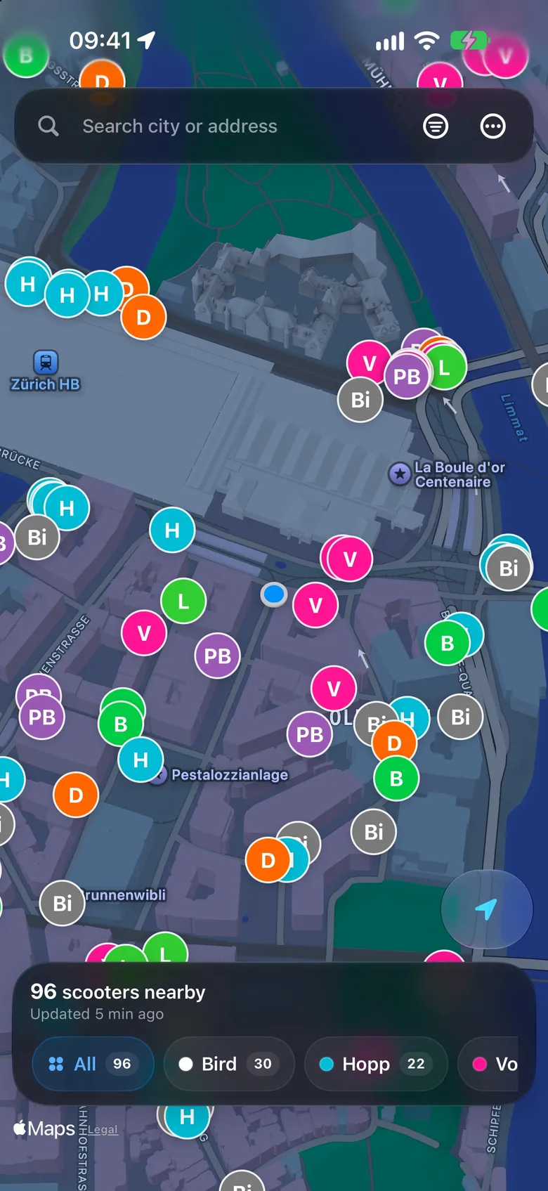 The iPhone app at night: a dark map of the streets by Zürich main station, covered in pins with each provider’s initials and colour, and 96 scooters nearby.